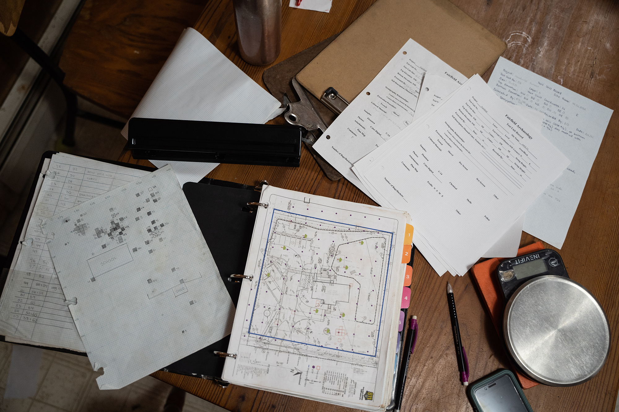 notes cover a wooden table