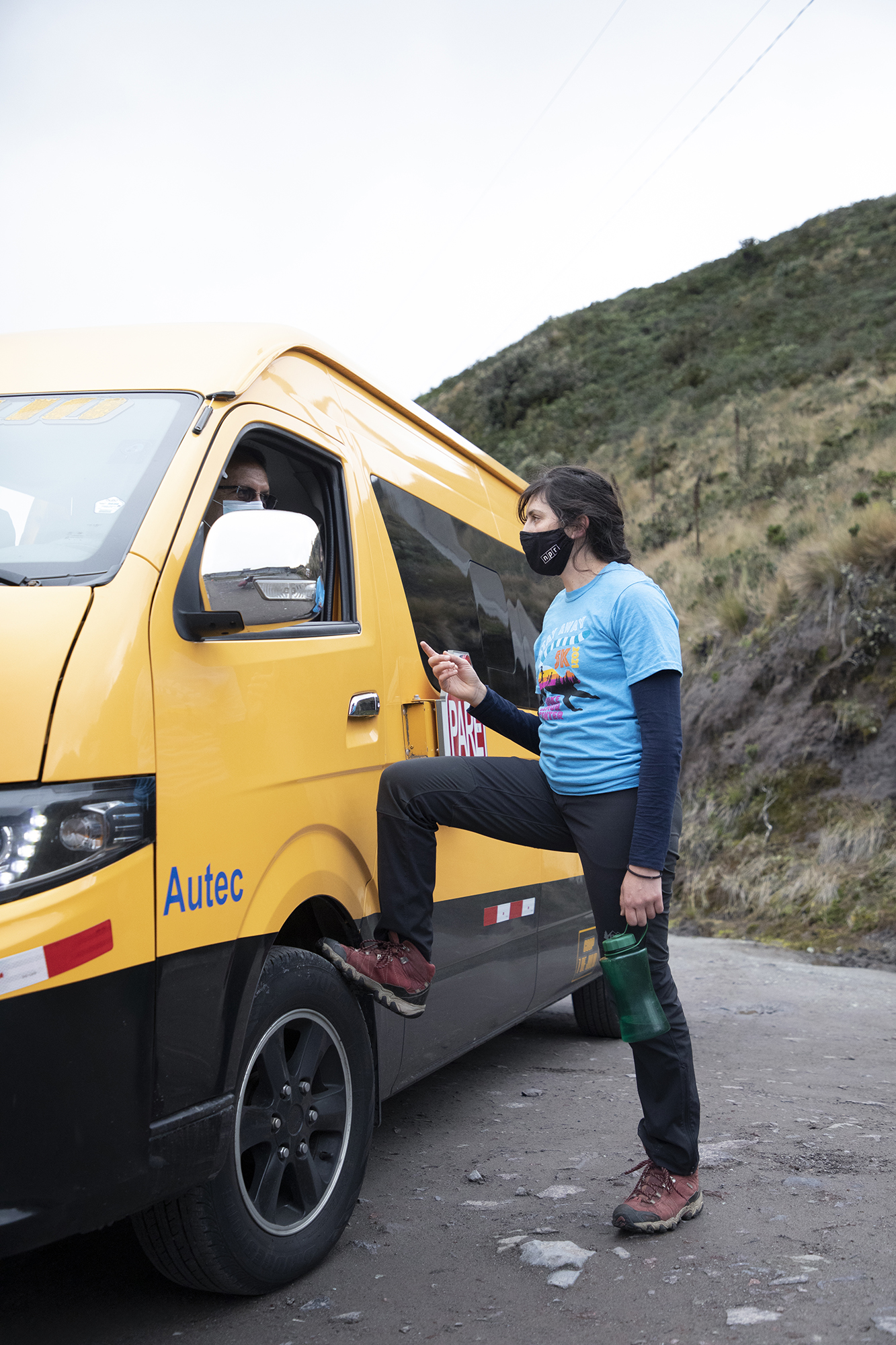 Kriddie Whitmore talks to a driver of a yellow van