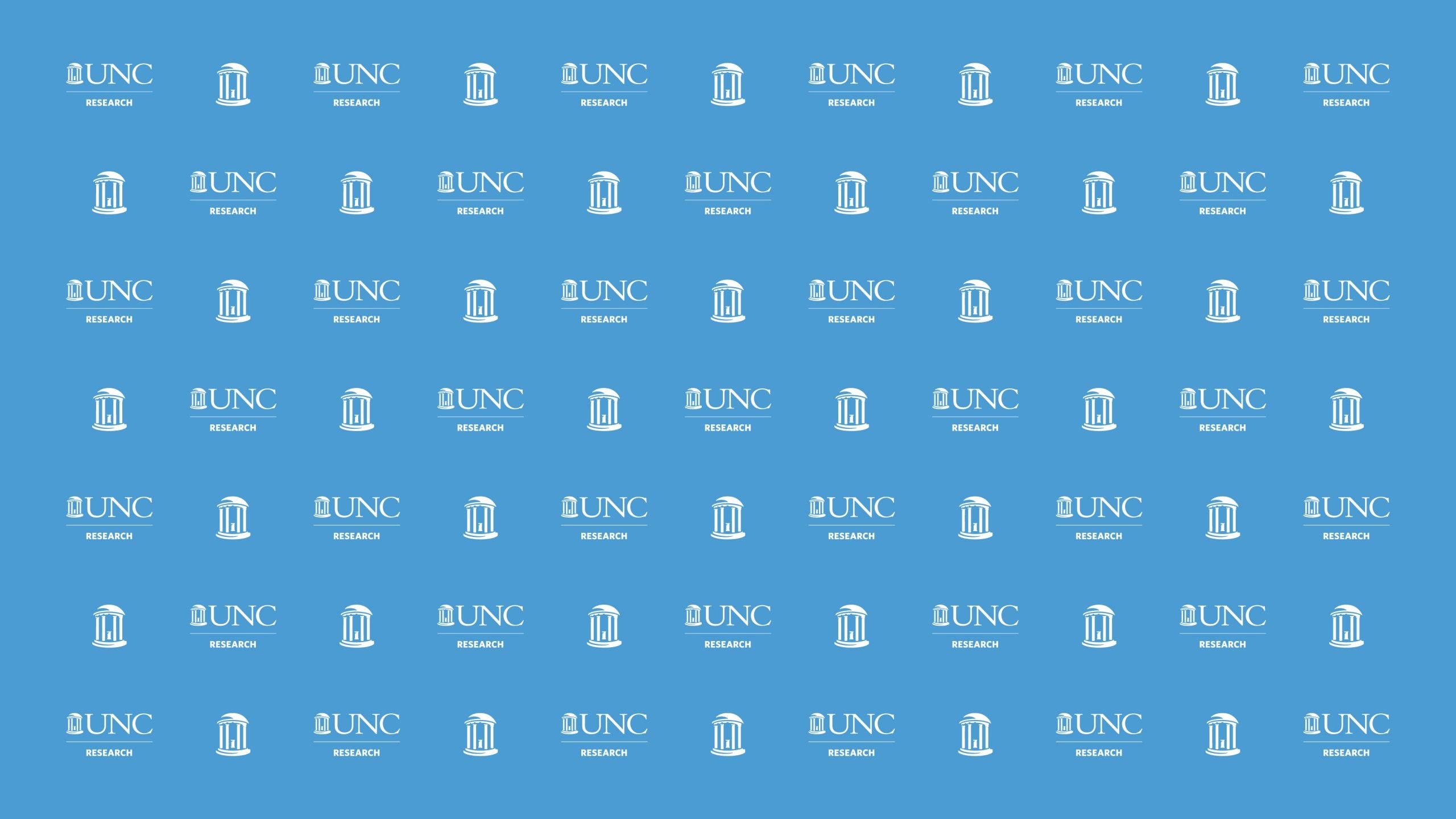 Step-and-repeat with the "UNC Research" logo and the UNC mark of the Old Well white on Carolina Blue.