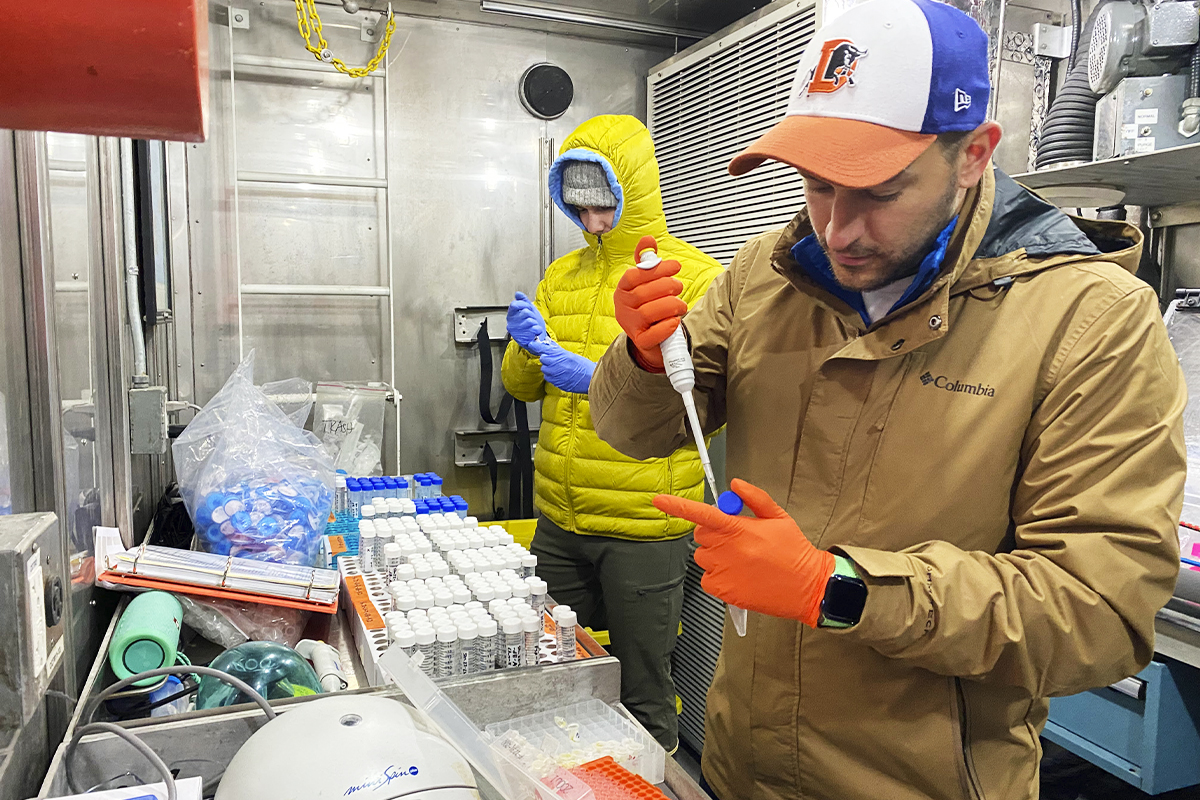 Two men working in the cold lab