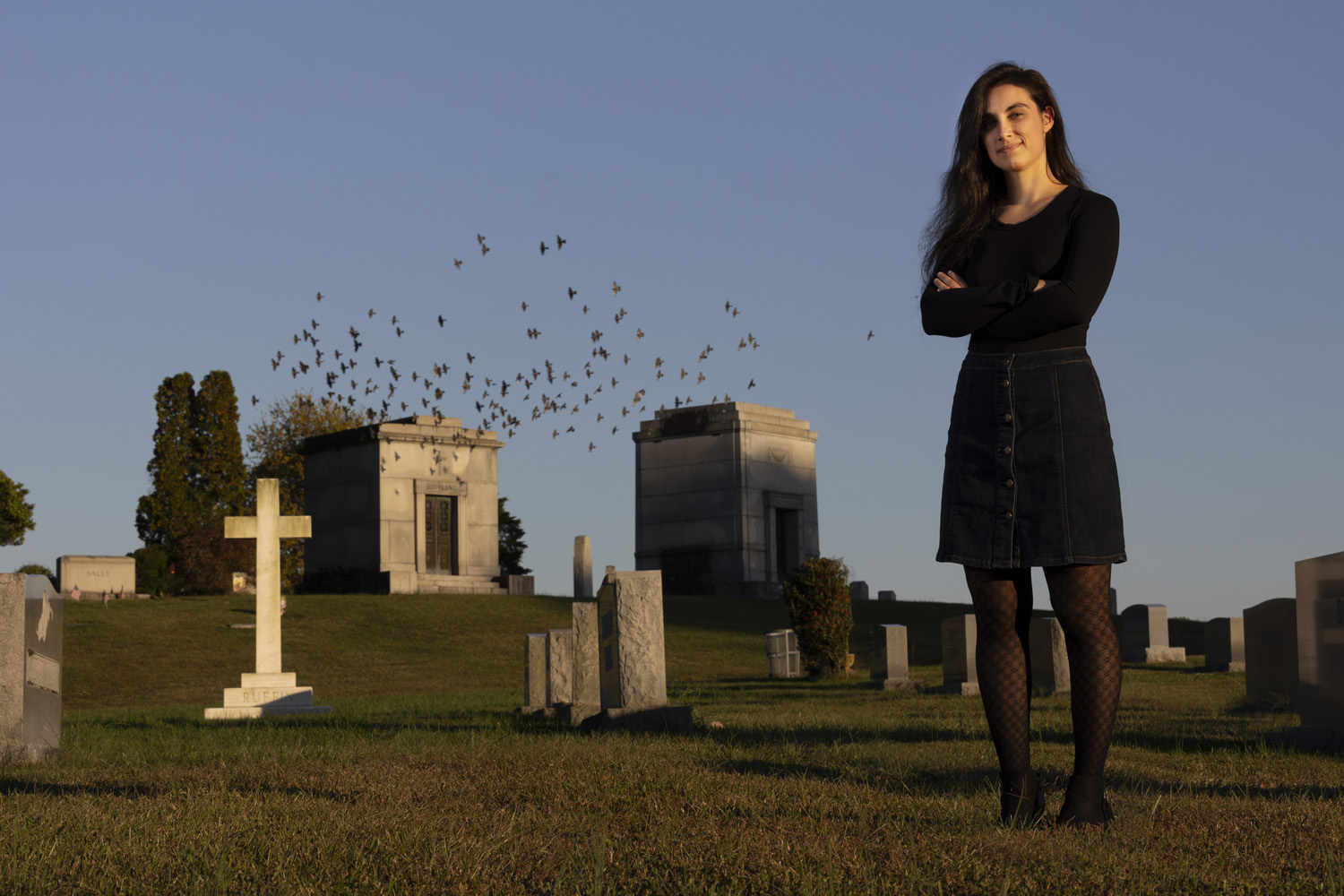 Michelle Freeman stands in a cemetery