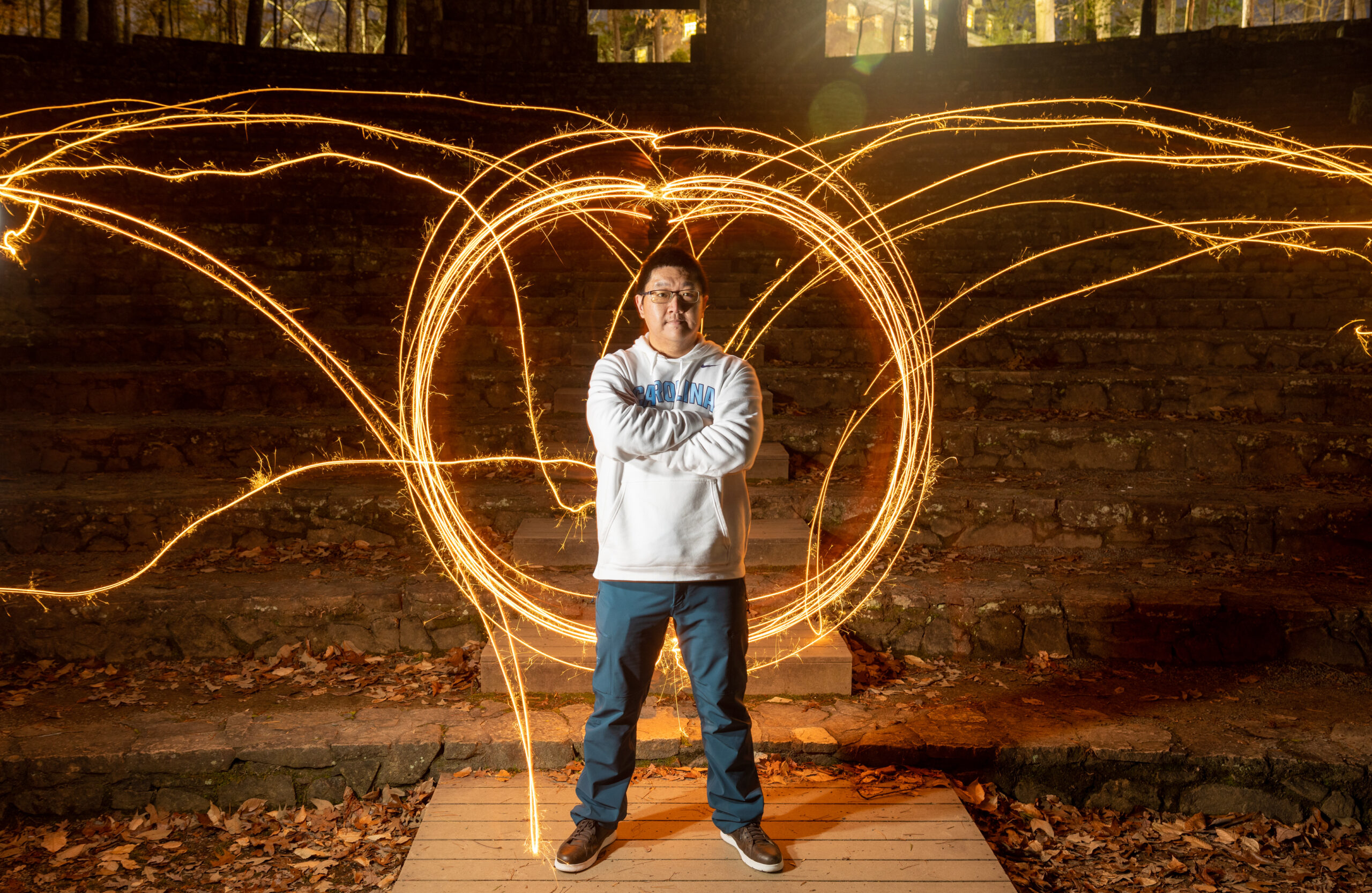 Aobo stands with him arms crossed as streams of light go all around him.