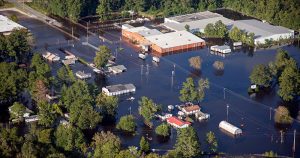 An aerial view of a flooded town.
