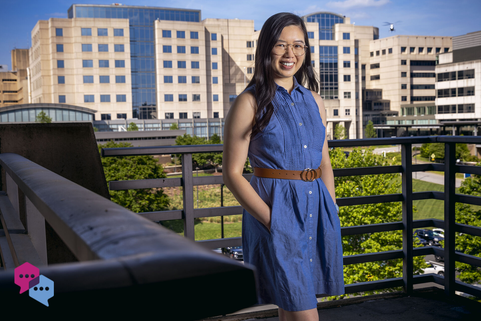 a young woman with the UNC Hospitals skyline in the background