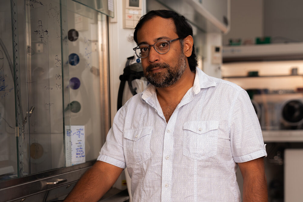 a man stands in a chemistry lab