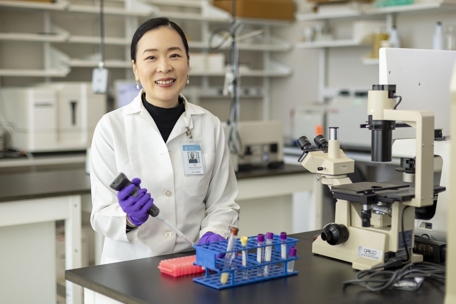 Grace Wu pipettes in her lab