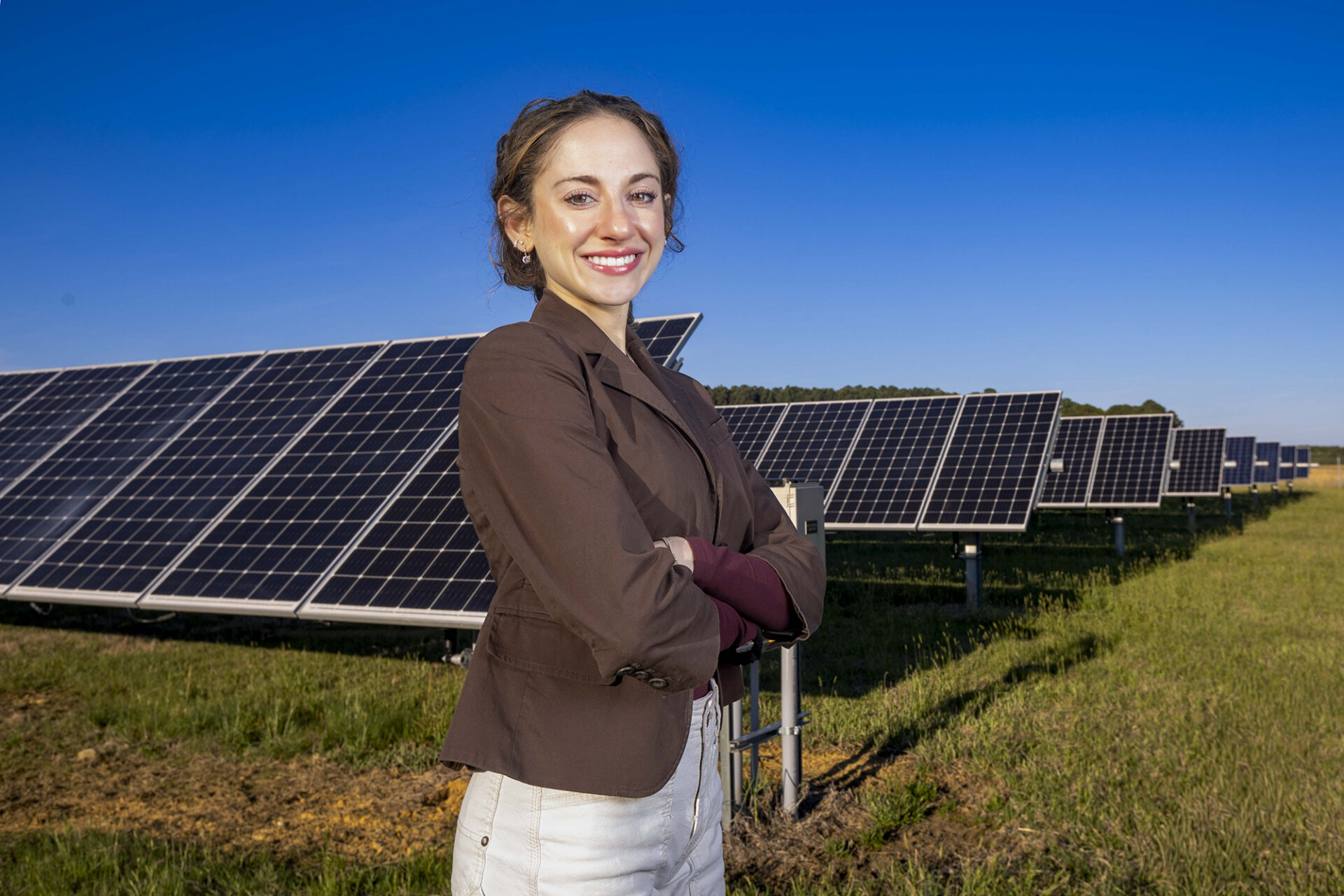Victoria Farella poses at the UNC Solar Farm