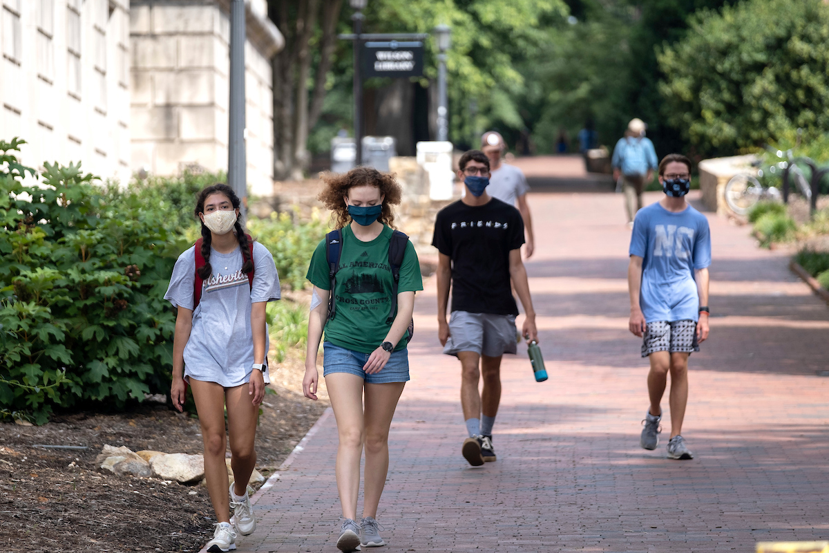 Students walking on UNC campus with masks
