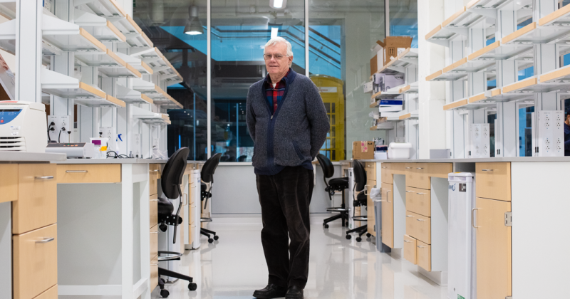 Michael O’Rand standing in an empty lab.